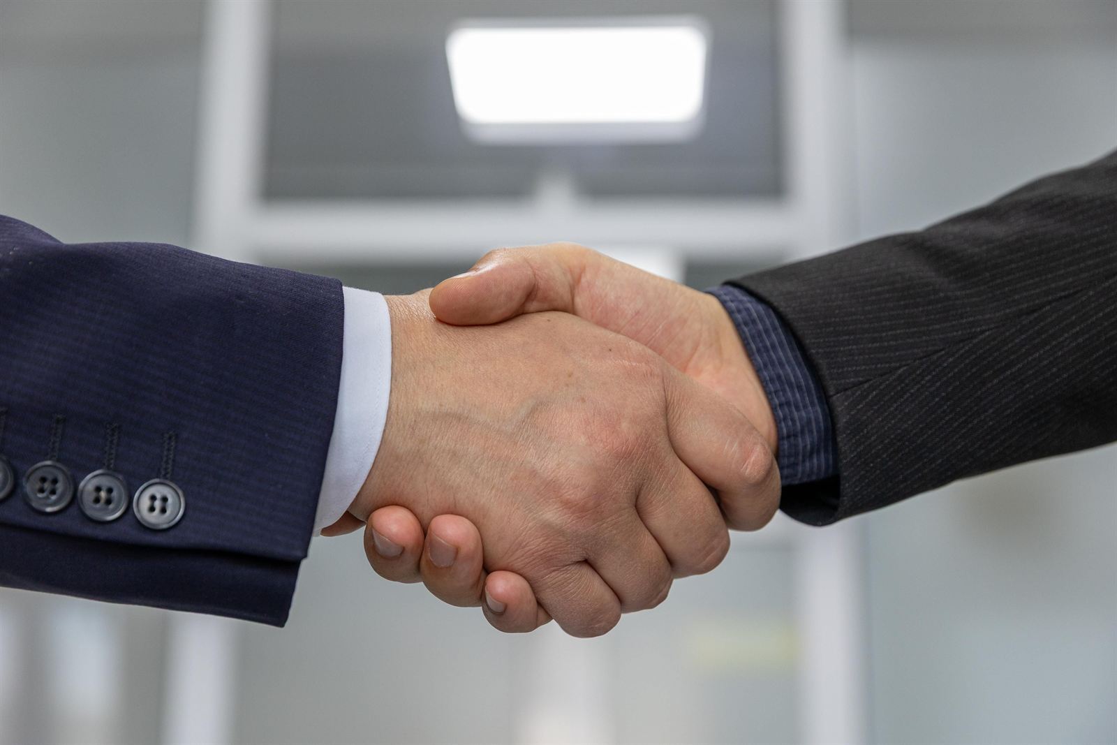 Handshake representing trust, partnership, and customer satisfaction